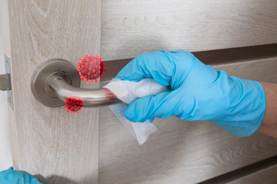 Duraclean® products in use for cleaning and disinfecting high-touch surfaces like door handles and light switches