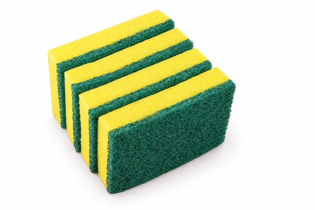 Yellow kitchen sponge in a cleaning setting